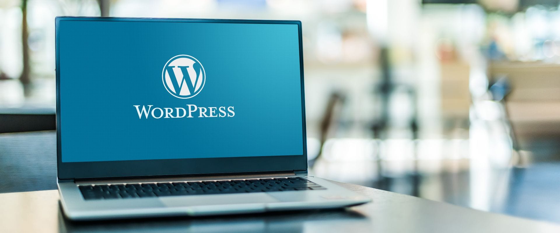 Laptop computer displaying logo of WordPress